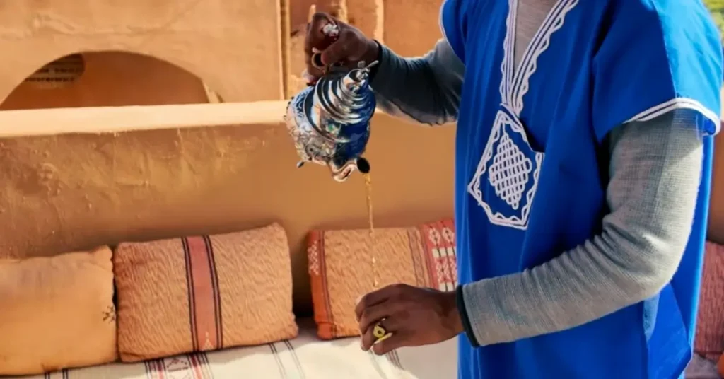 Serving Moroccan mint tea at a kasbah terrace in Ait Ben Haddou
