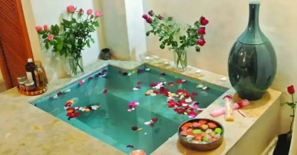 Traditional Moroccan hammam spa with rose petals and bath oils Marrakech Morocco Tours