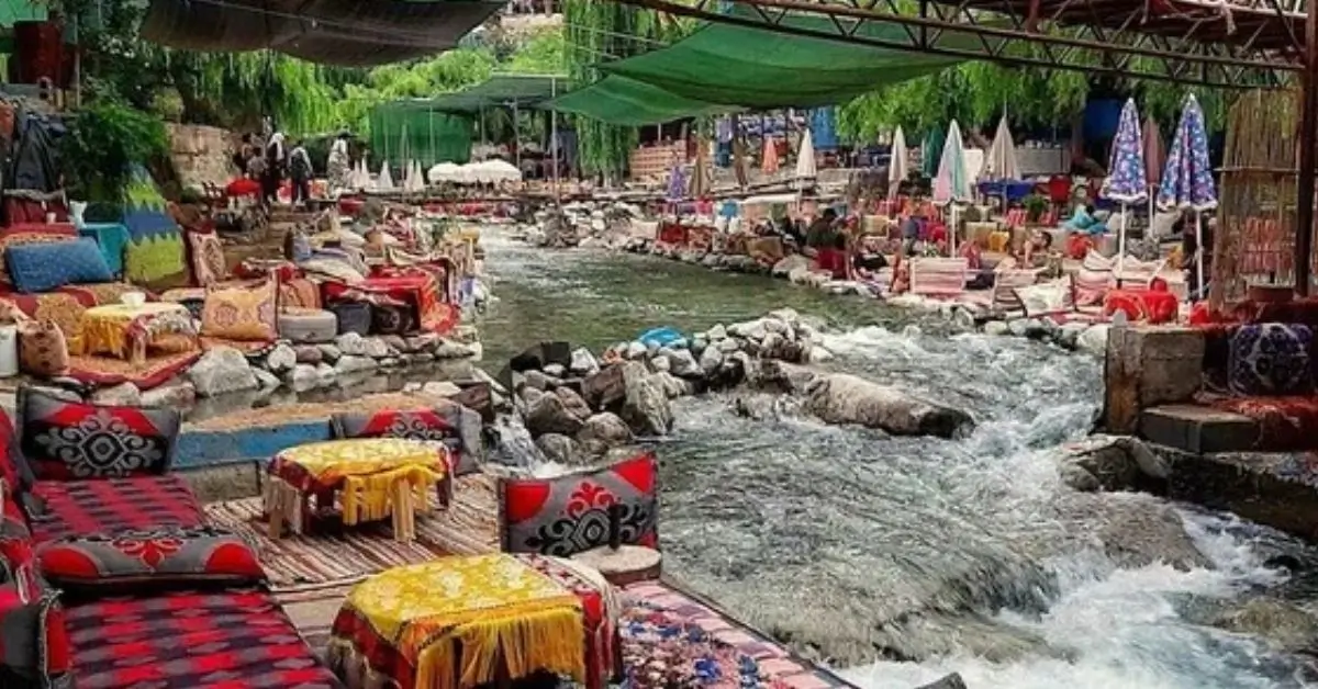Colorful seating by the river in Ourika Valley near Marrakech best morocco tours