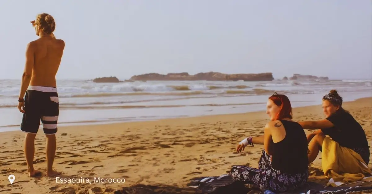 Tourists relaxing on the beach in Essaouira during a Morocco trip