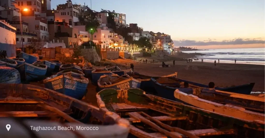 Fishing boats at Taghazout Beach at sunset – coastal stop on Morocco small group tours
