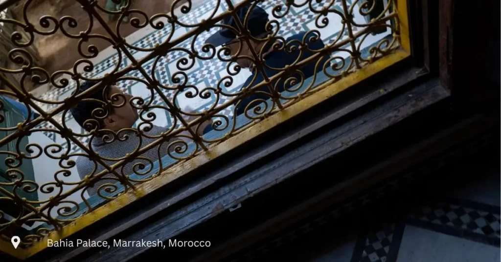 View through traditional ironwork at Bahia Palace Marrakech – Morocco small group tours cultural experience