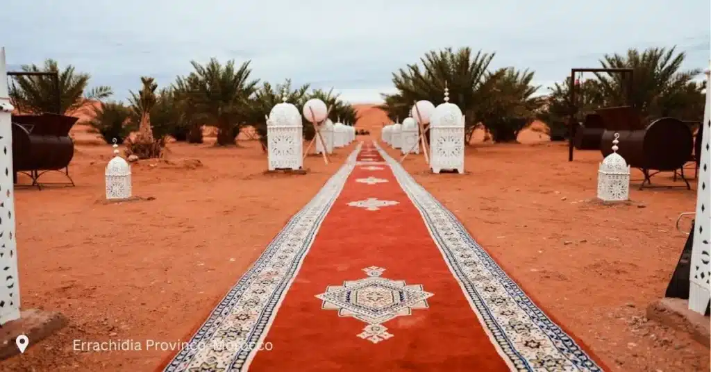 Morocco small group tours desert camp Errachidia with traditional Berber decor and red carpet