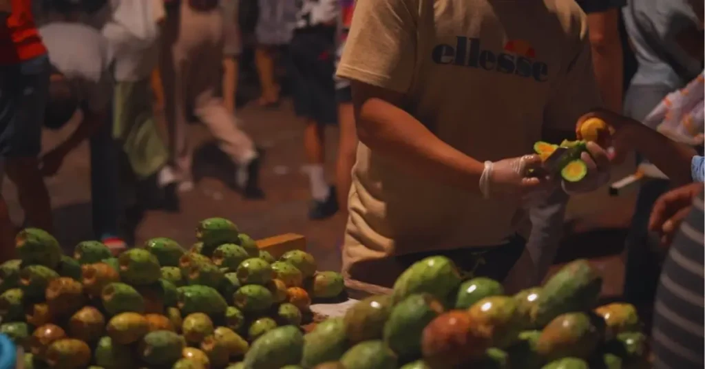 Street vendor selling prickly pears at night in Rabat Medina