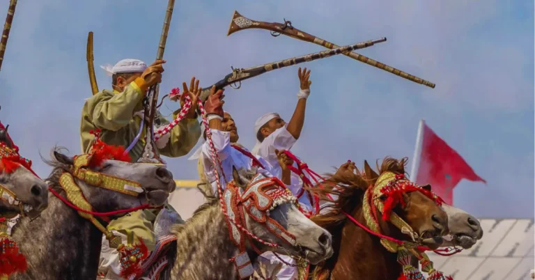 Traditional Tbourida riders performing Fantasia, expressing Moroccan heritage.is morocco a country